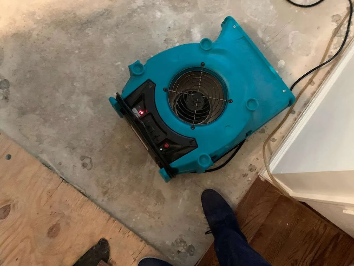 Air mover drying subfloor during Leak Detection & Repair in Allegheny